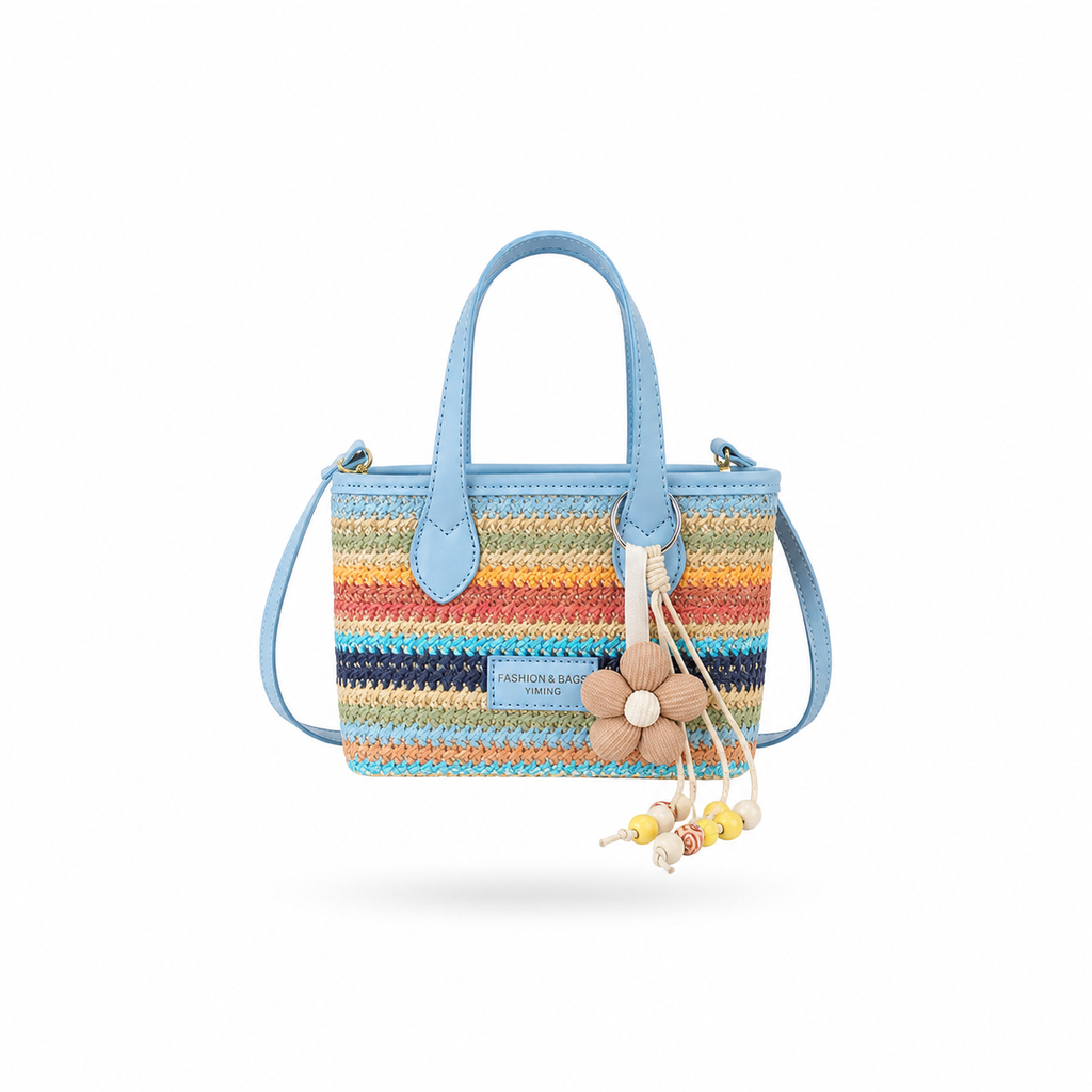 Rainbow woven mini tote crossbody bag with blue handles and shoulder strap on white background